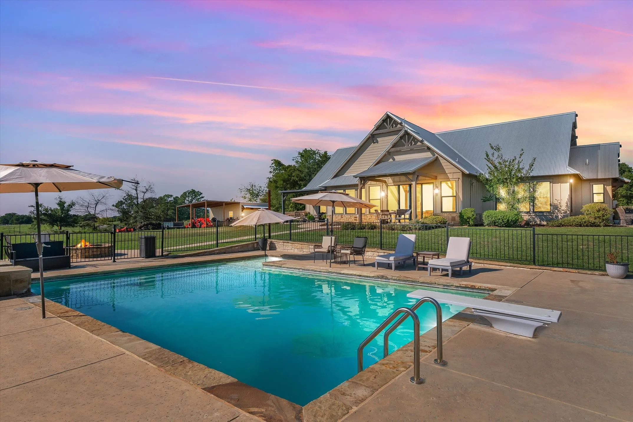 Swimming pool has views of the green pastures