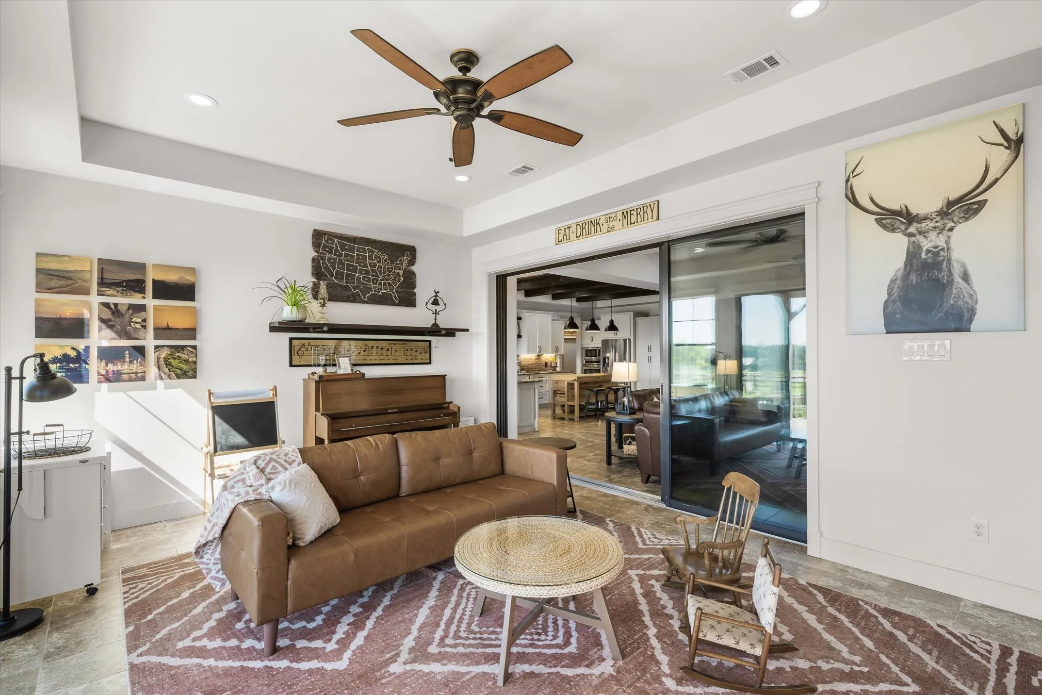 Through gorgeous sliding glass doors to a 2nd living area that leads to the patio that leads to the pool area- all very dreamy