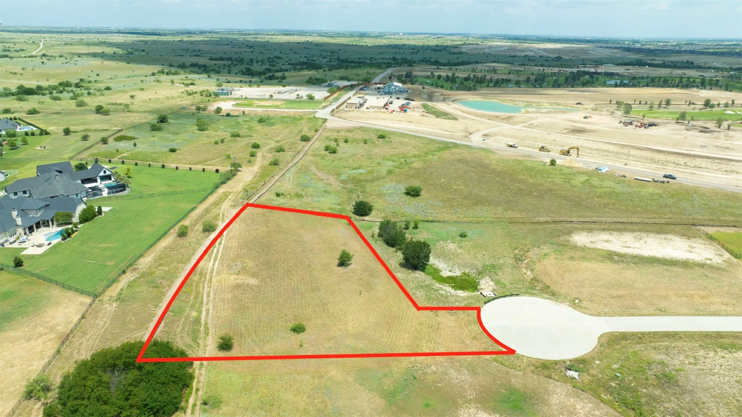 Expansive parcel of unimproved land situated at the terminus of a paved cul-de-sac