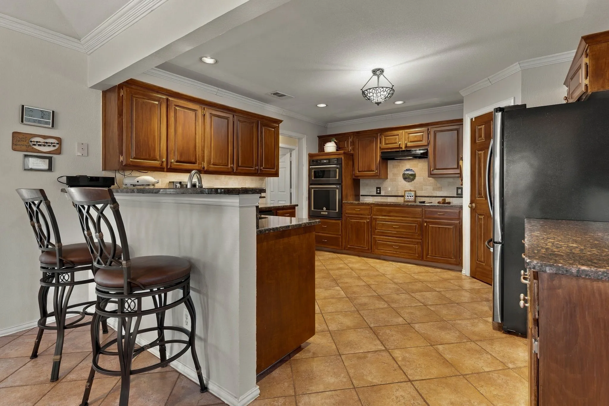 Breakfast Bar. Raised Panel Cabinets. Coffered Ceiling.