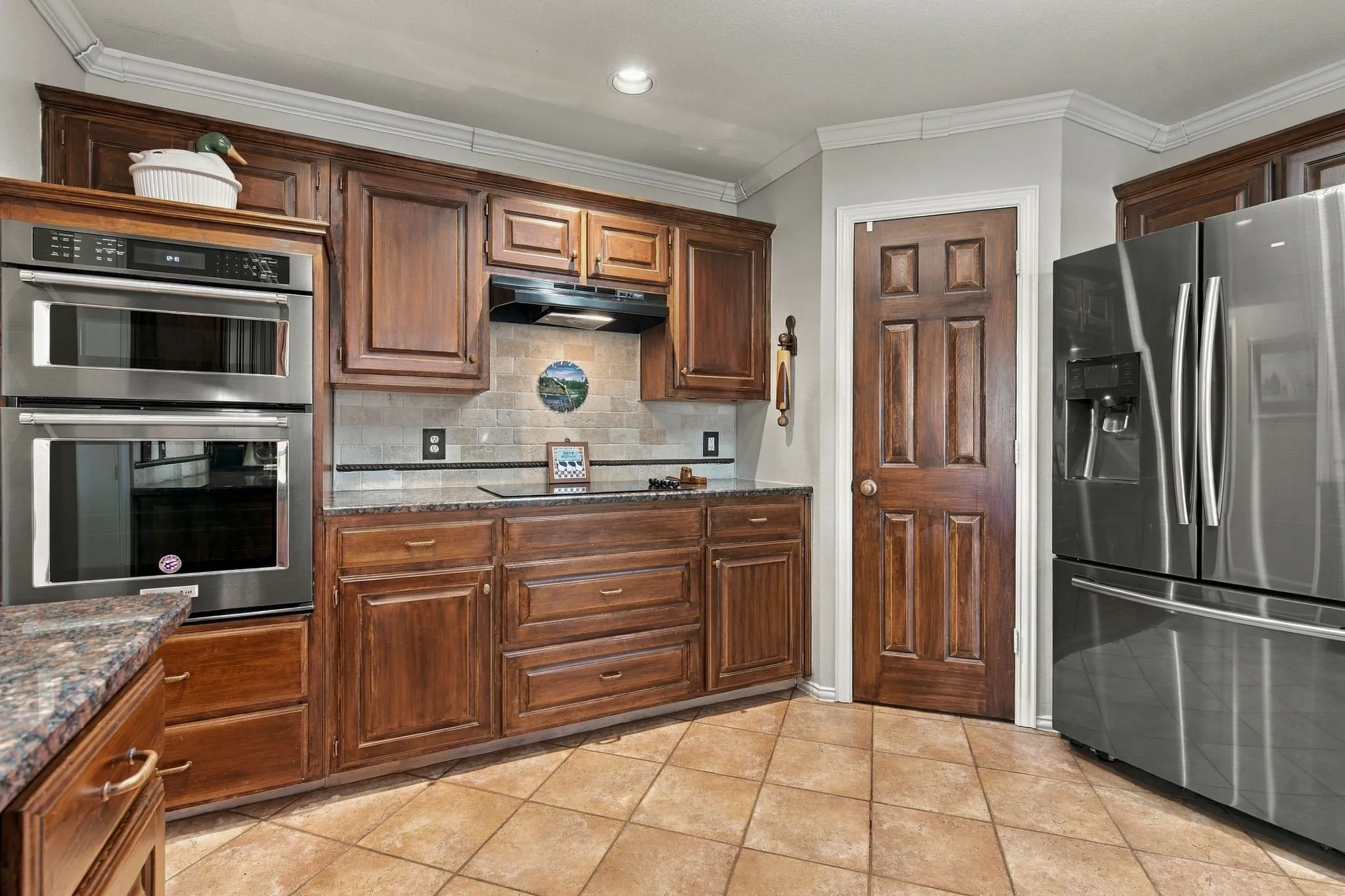 Built-in Oven and Microwave. Smooth Cooktop. Walk-in Pantry.