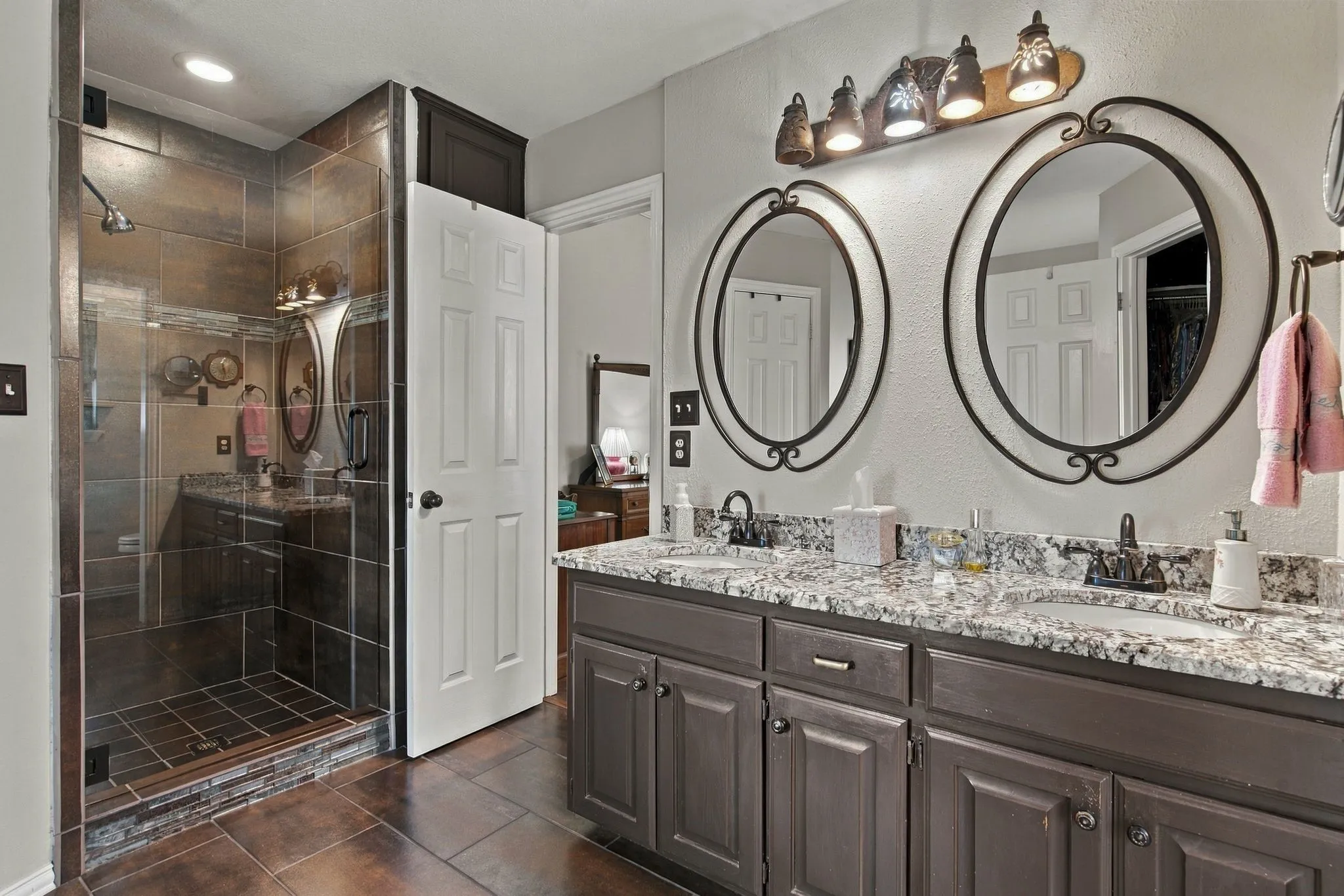 Updated Bathroom.  Dual Sinks. Raised Panel Cabinets. Walk-in Shower.