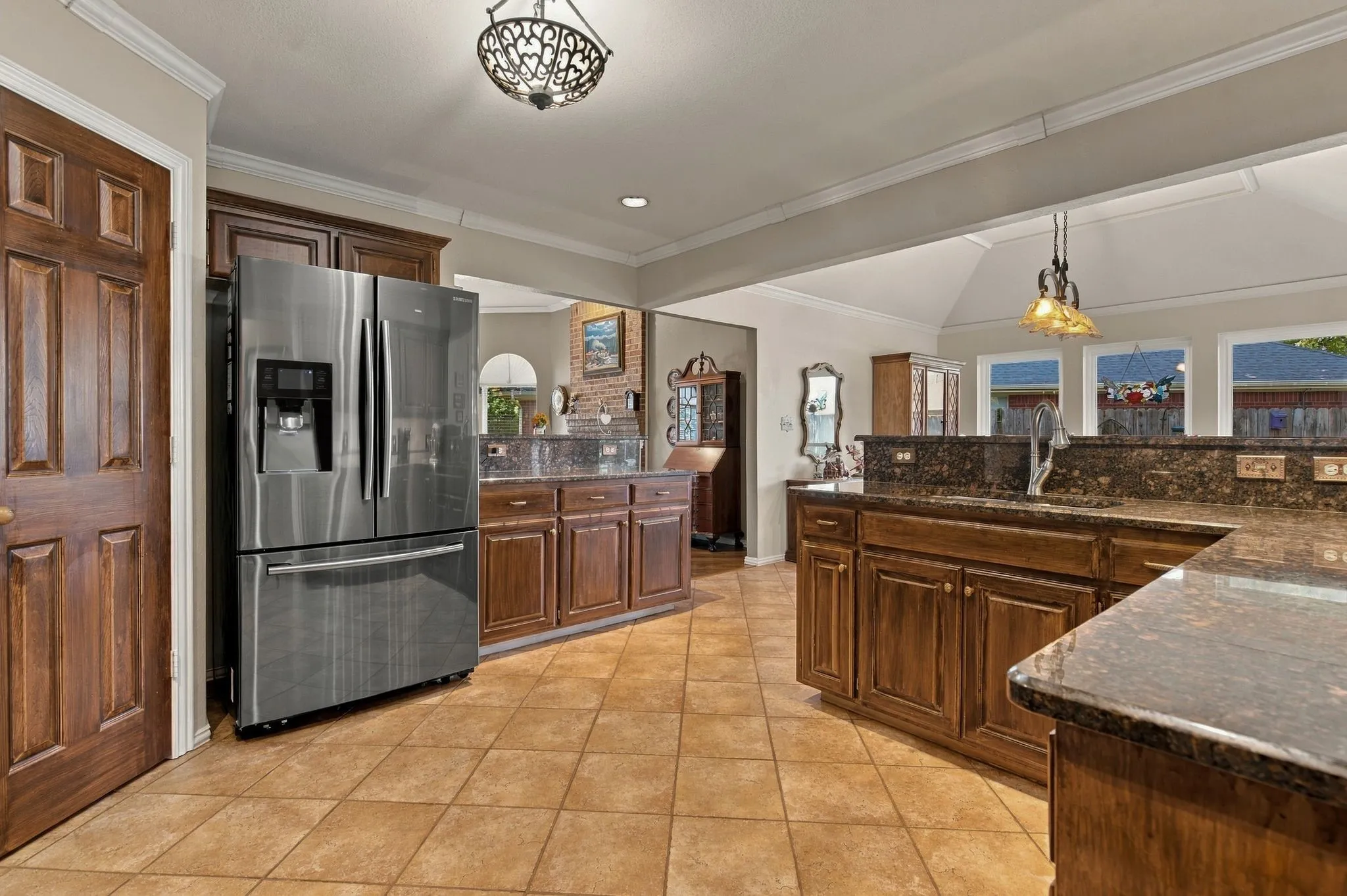 Granite Counters. SS Appliances. Diagonal Tile Layout.