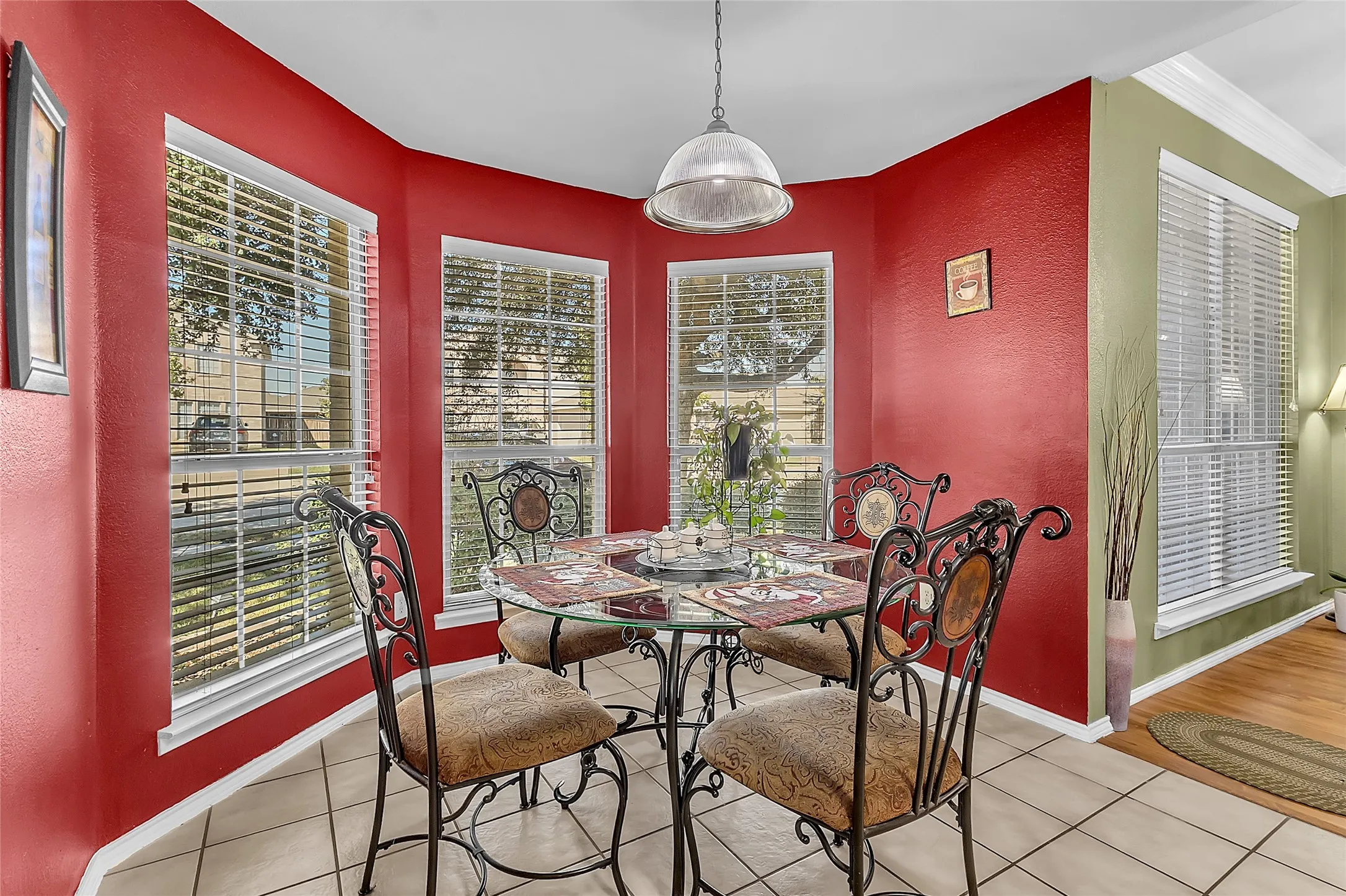 Bay-window breakfast nook with tile floors and pendant light — Denton