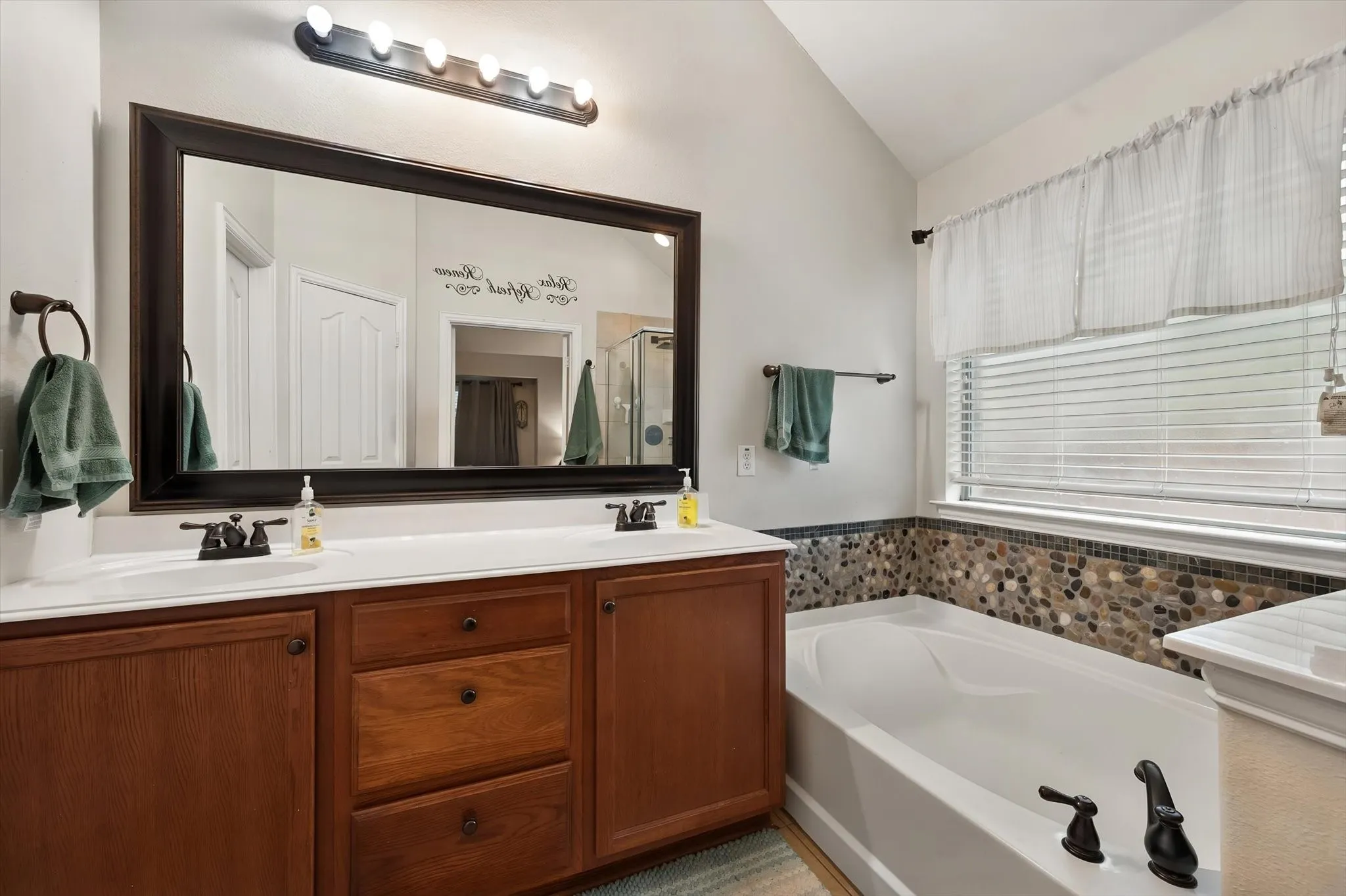 Primary bathroom has separate tub / shower and dual sinks.