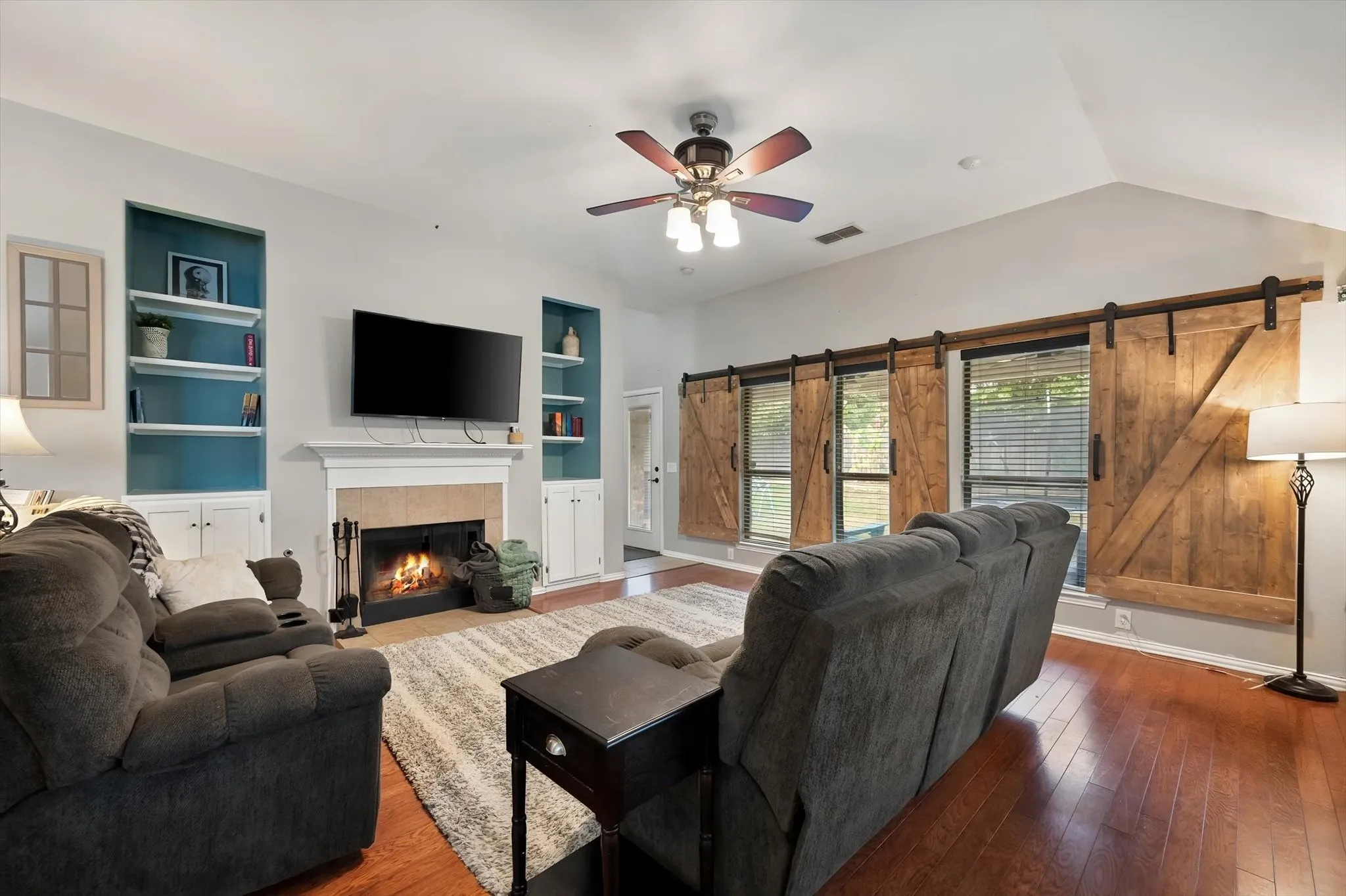 Cozy fireplace and built in shelving!