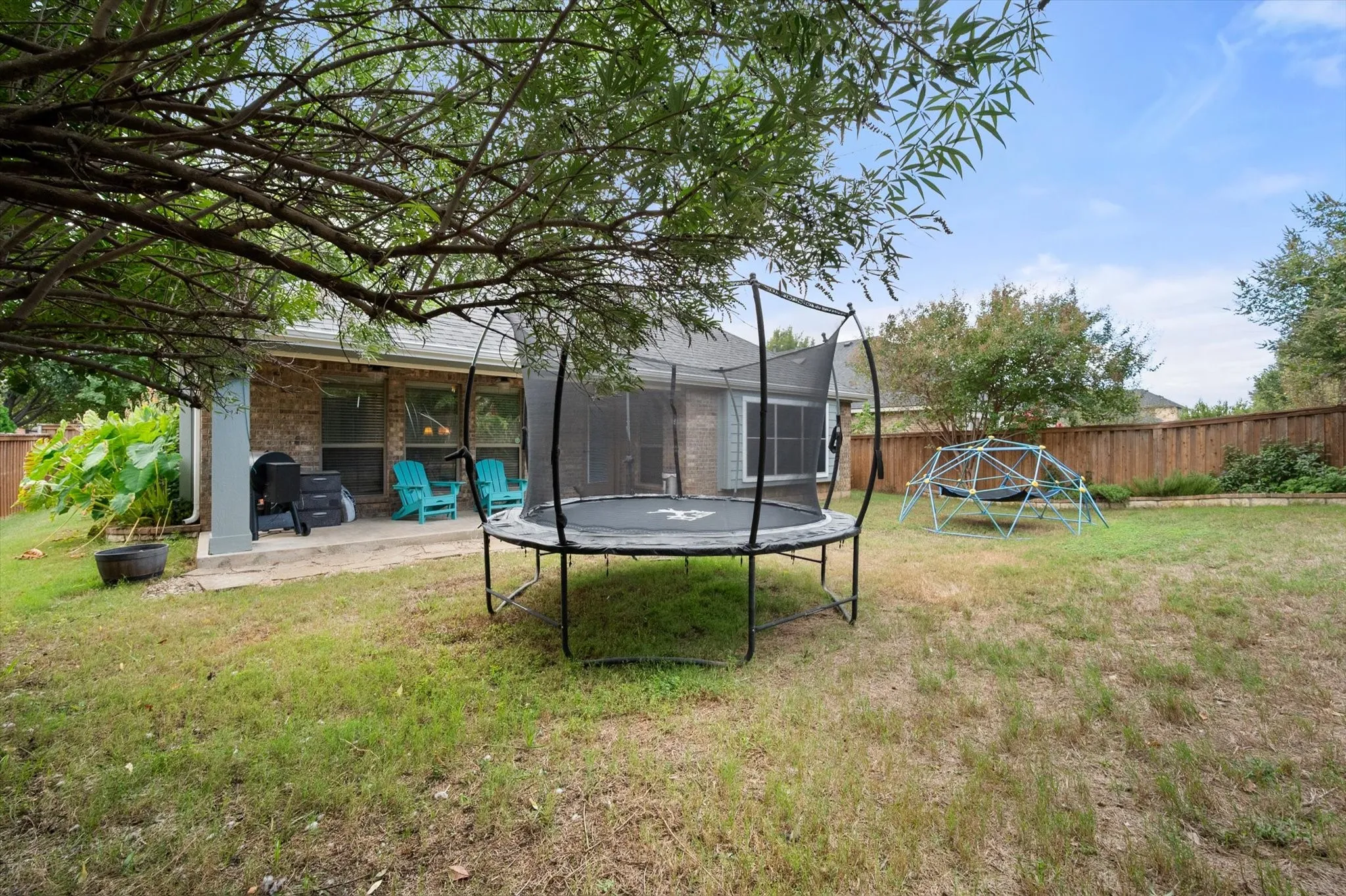 Spacious fenced in back yard.