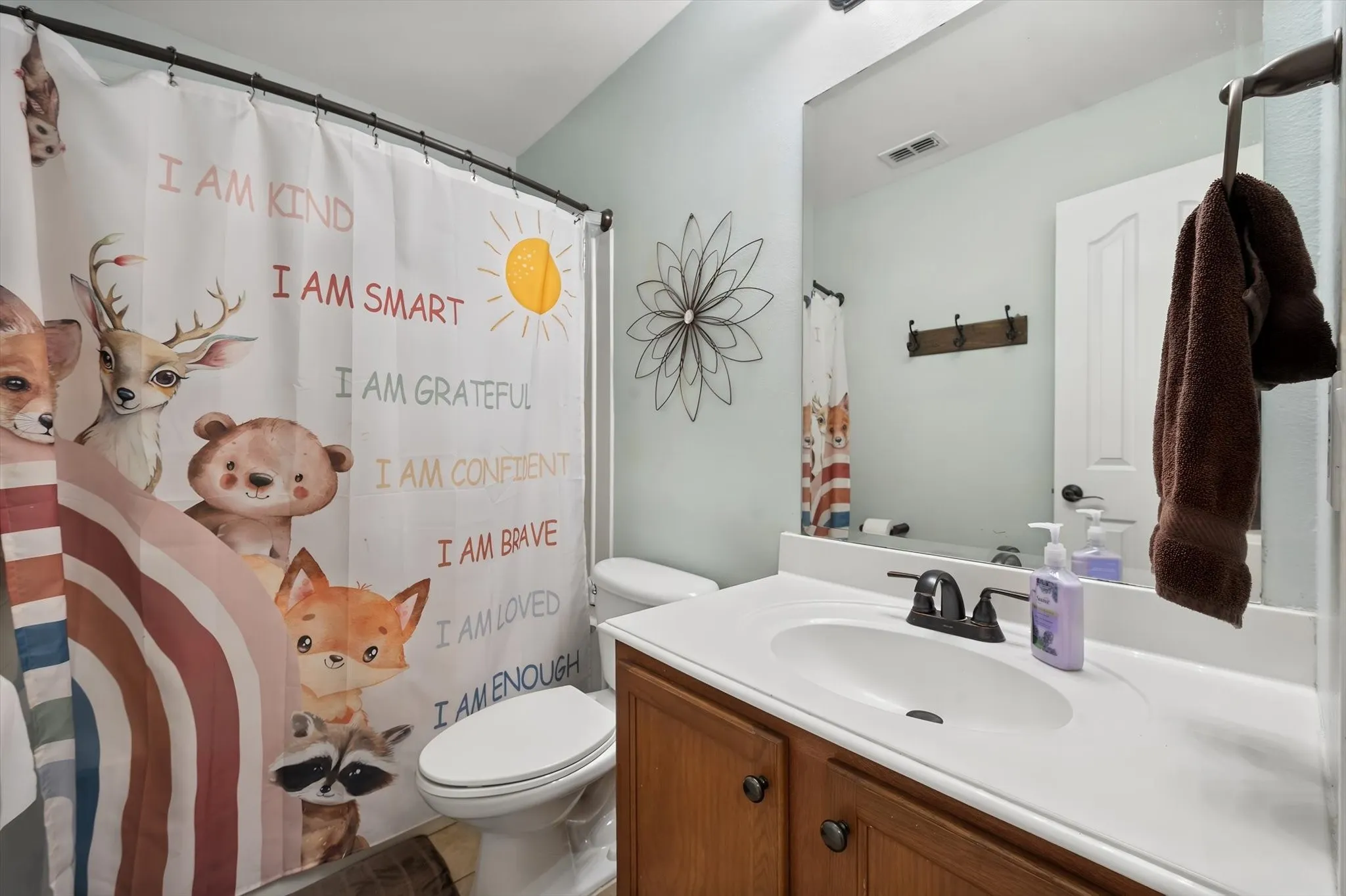 Bathroom 2 has tub/shower combo and large vanity.
