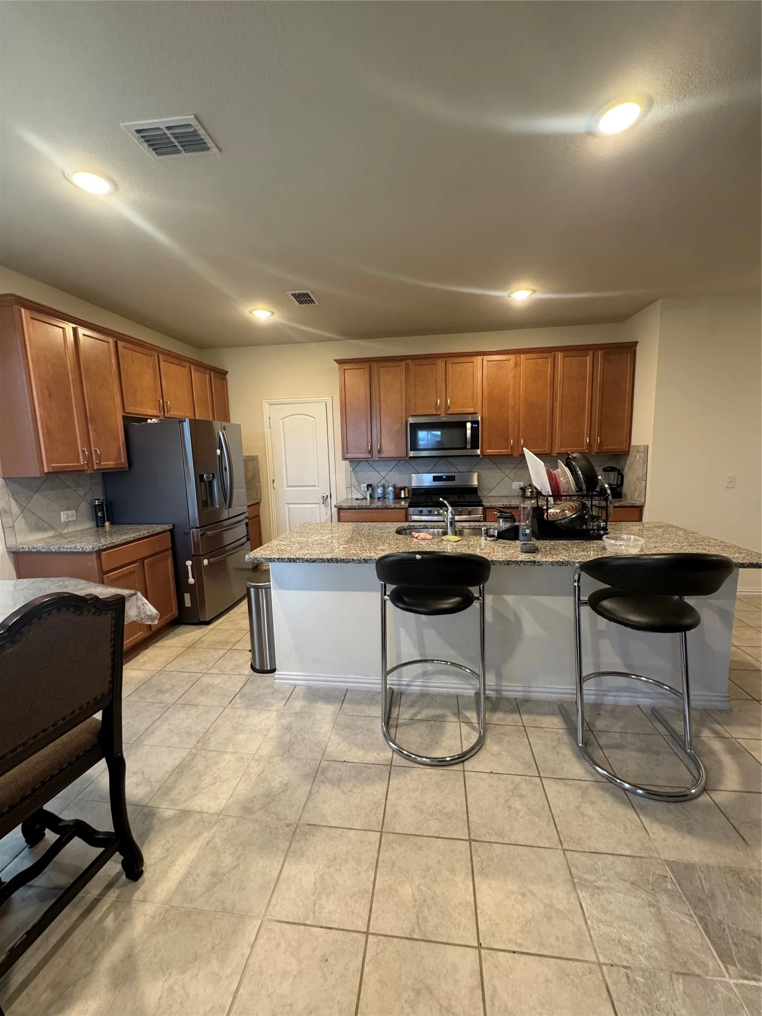 Island bar area. All appliances included.