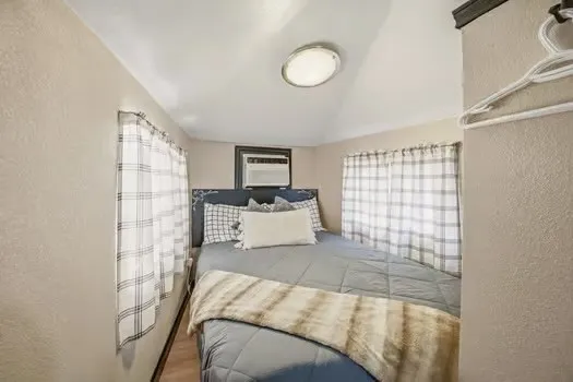 TV to watch in double bed on opposite wall