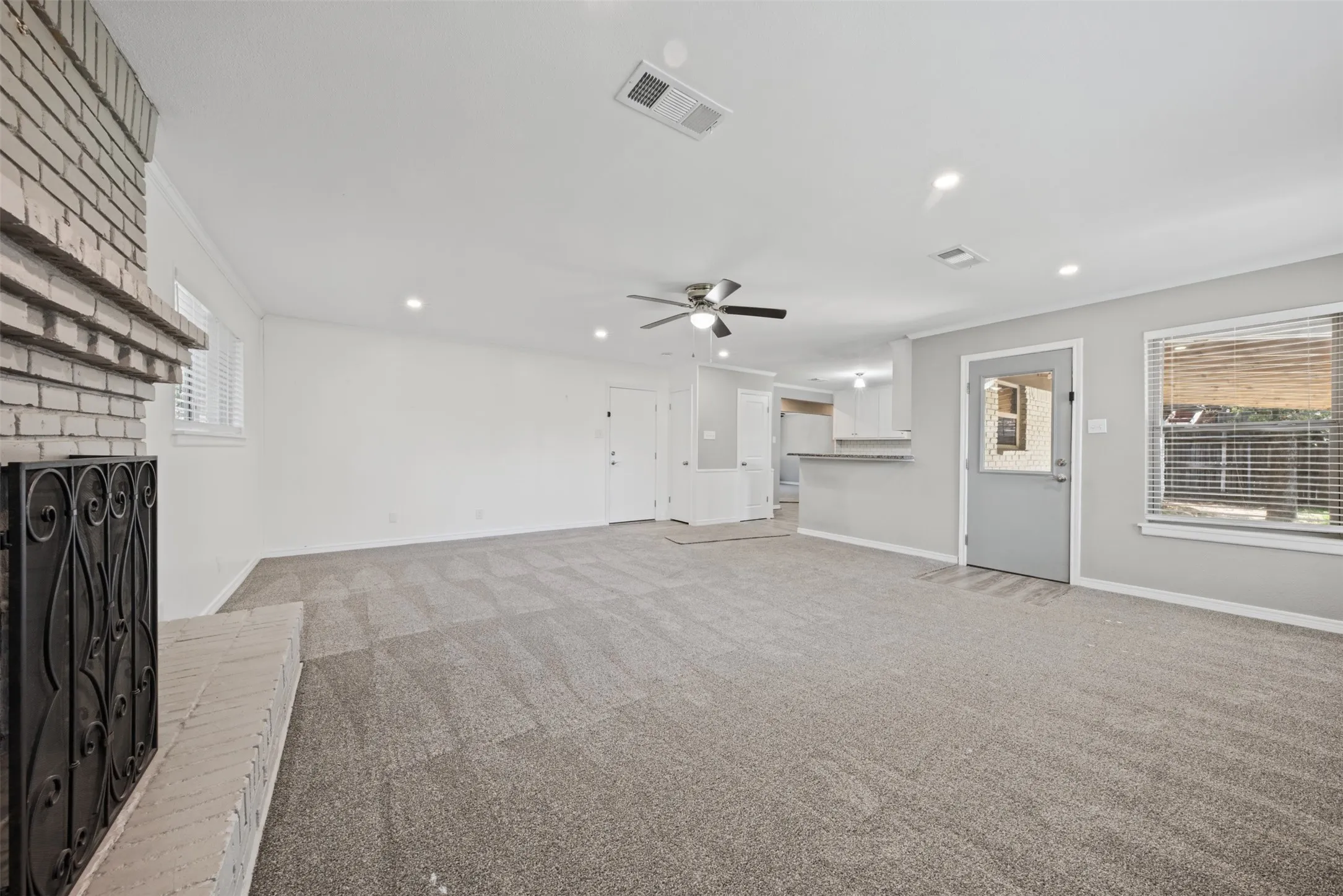 Family Room off of the kitchen with access to the large covered patio deck.