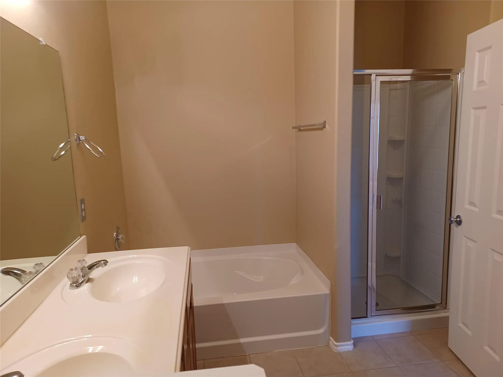 Dual vanity with integral sinks, cultured marble countertop, and chrome faucets