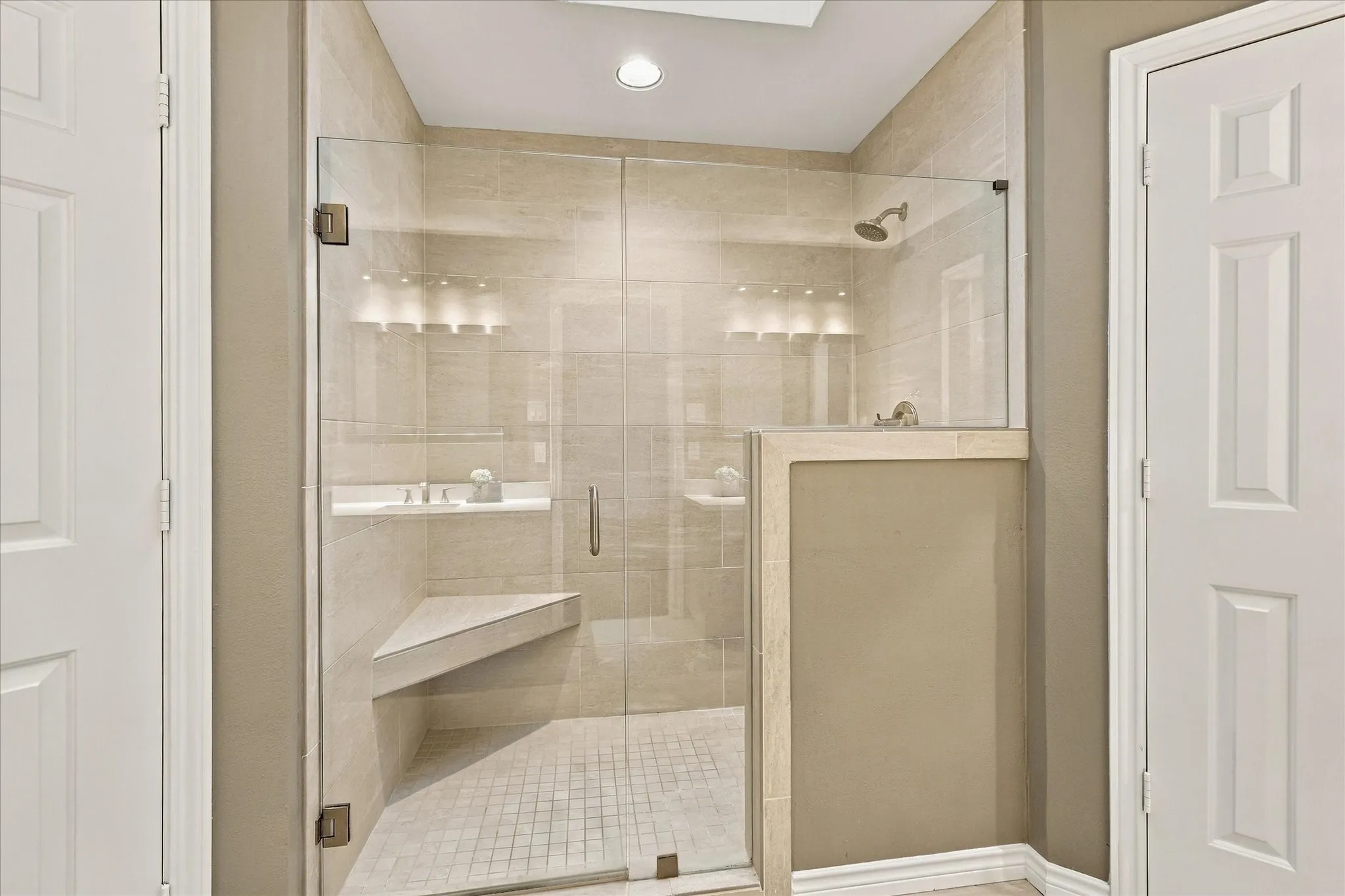Primary bathroom with walk-in shower.