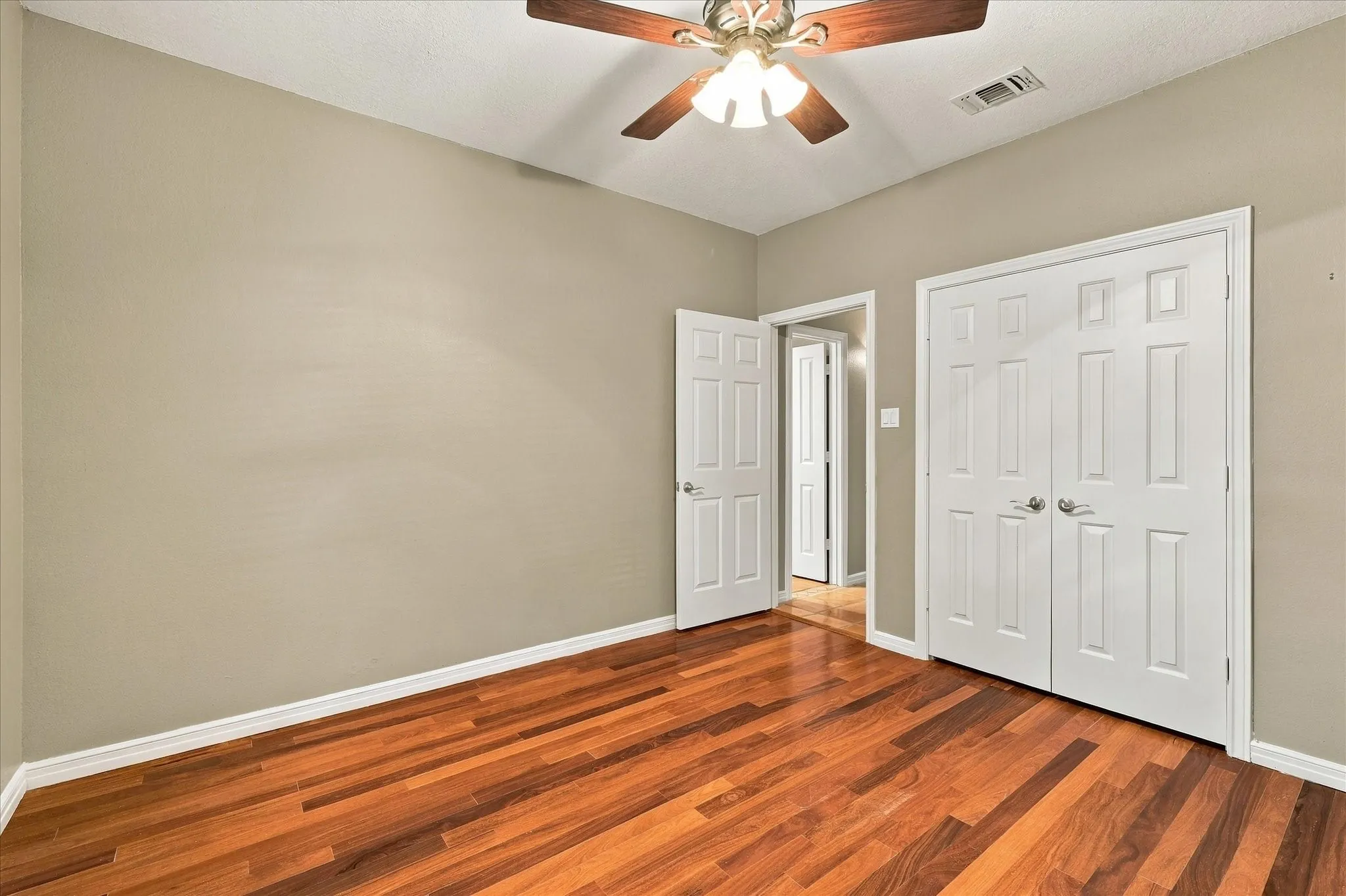 Another view of the secondary bedroom and closet.