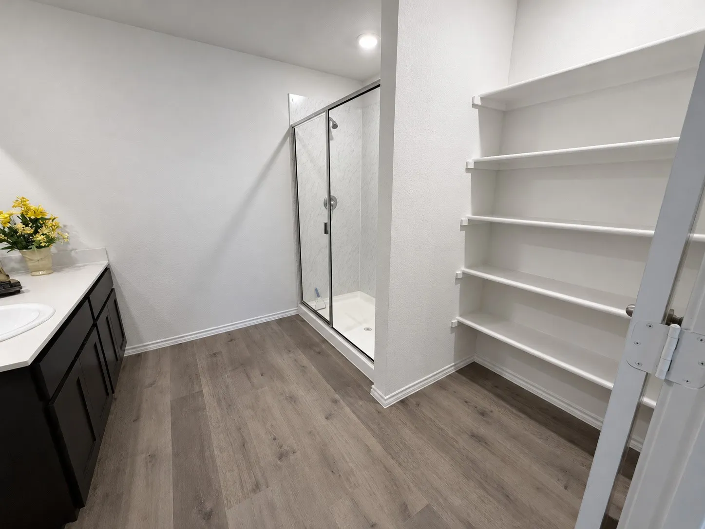 Primary Bath with built-in shelves and Walk-in Shower