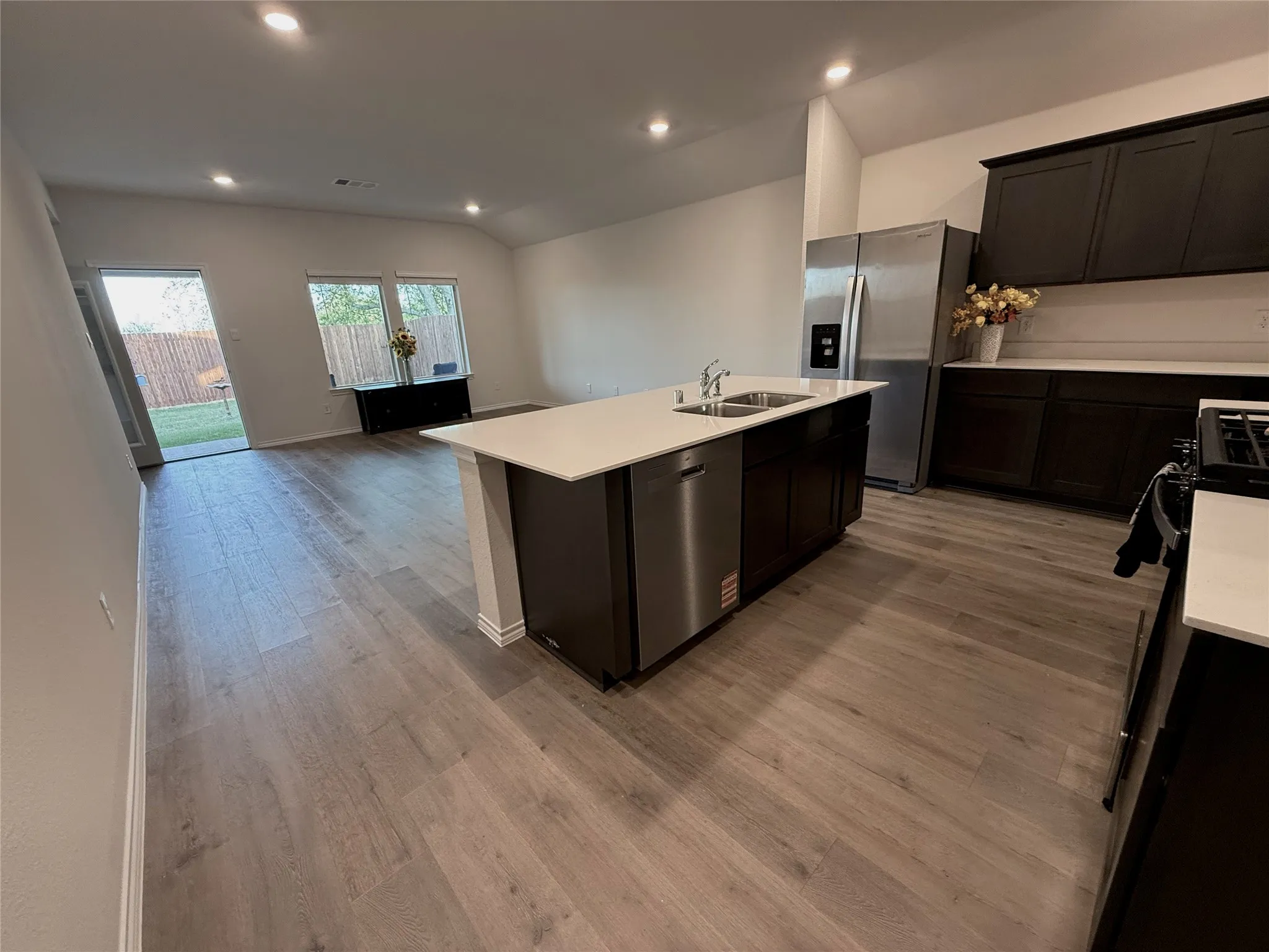 Kitchen with large Island and Open Concept into Living Room.