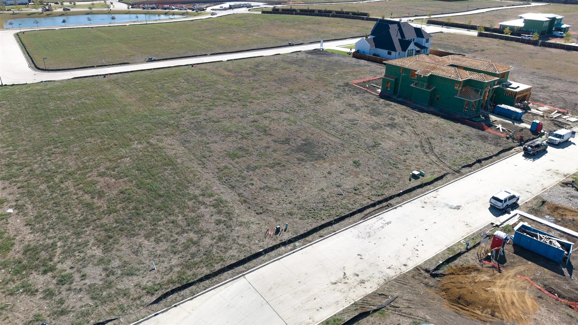 Expansive corner residential lot featuring paved street access and open landscape