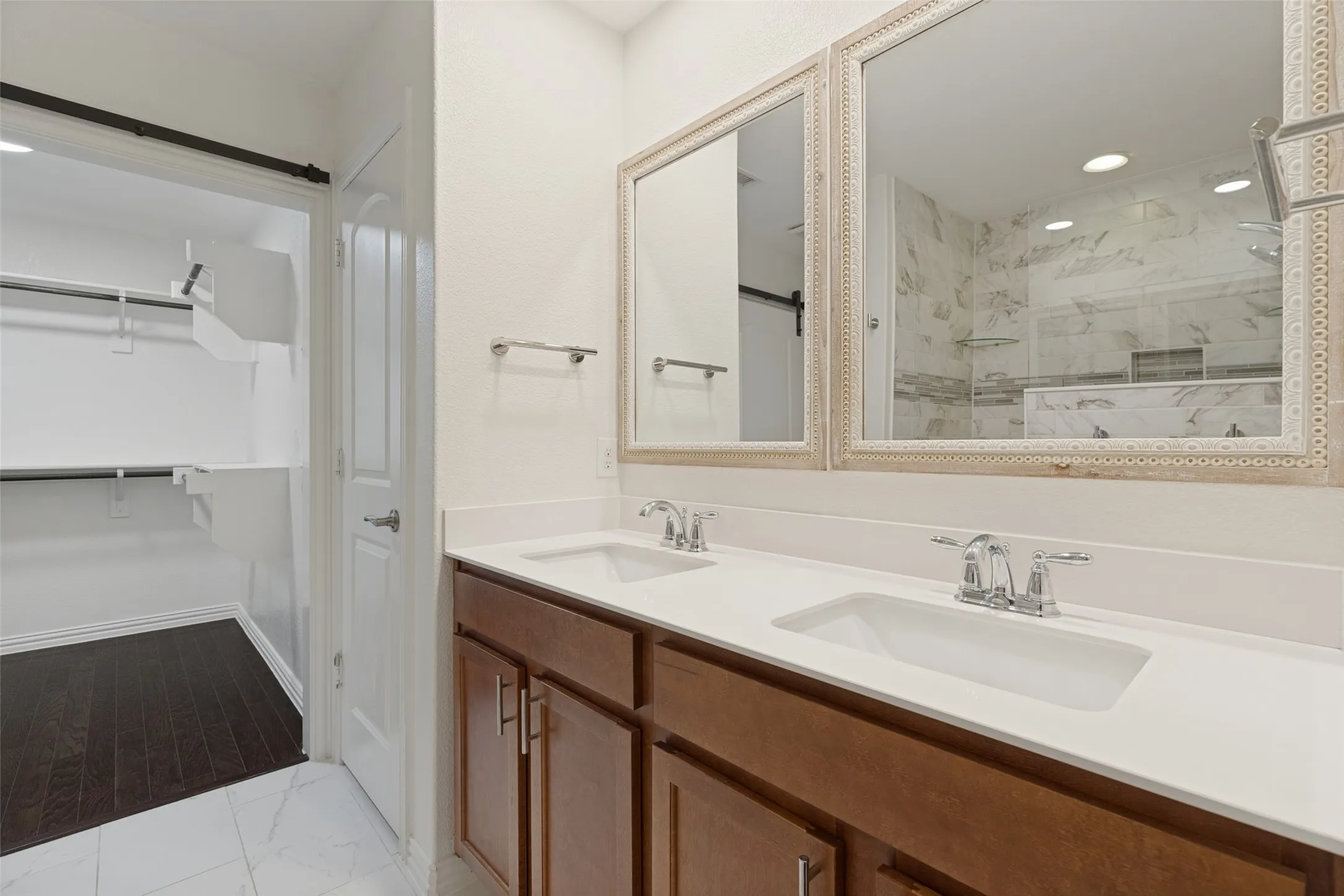 PRIMARY BATH HAS A DOUBLE VANITY WALK IN CLOSET AND A GEORGOUS SHOWER