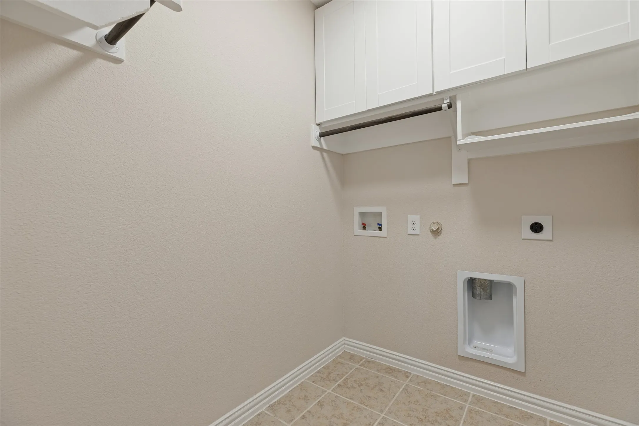 THE LAUDRY ROOM HAS UPGRADED CABINETS FOR PLENTY OF STOREAGE