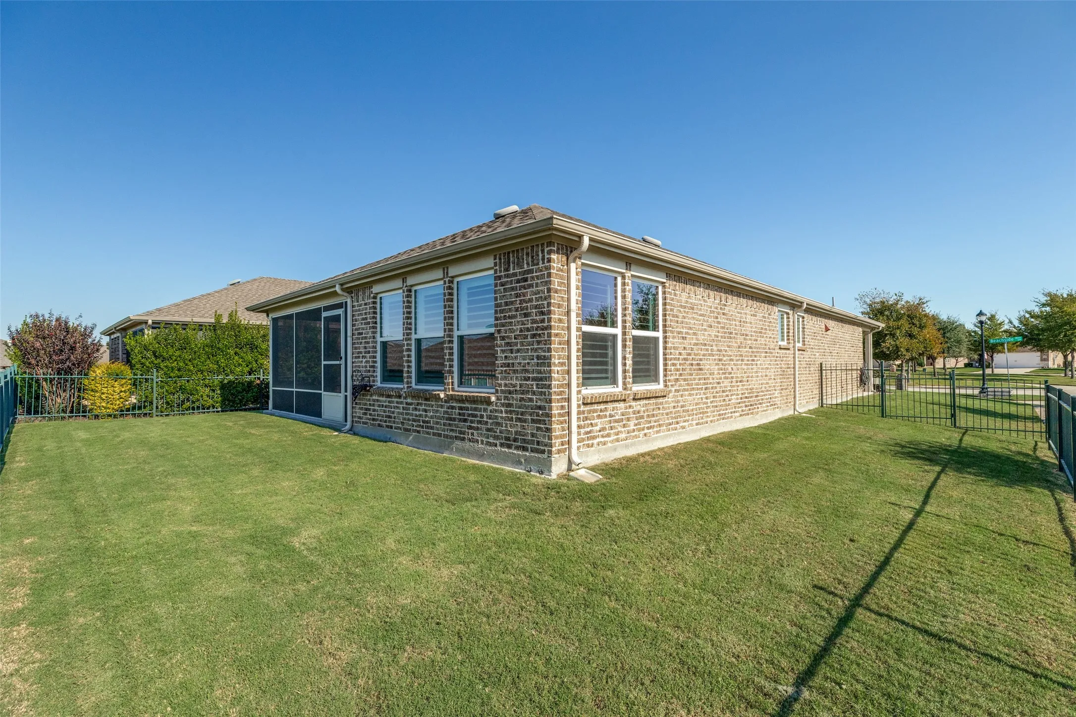 THE BACK YARD IS LARGE AND FULLY FENCED WITH CUSTOM WROUT IRON THIS HOME HAS A COMPLETE SPRINKLER SYSTEM
