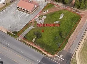 Corner lot featuring street frontage, paved access, and open terrain