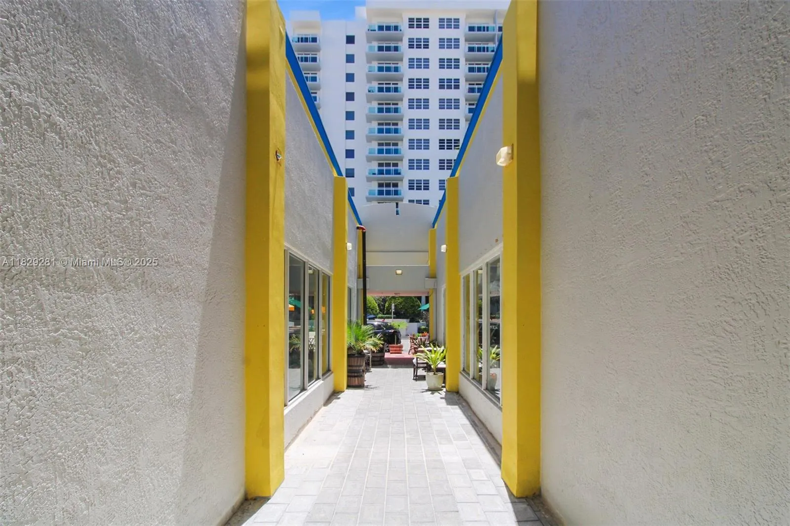 Corridor from Collins next to Iron Sushi through which the office building lobby and elevator may be reached connecting the offices to Collins and dining options
