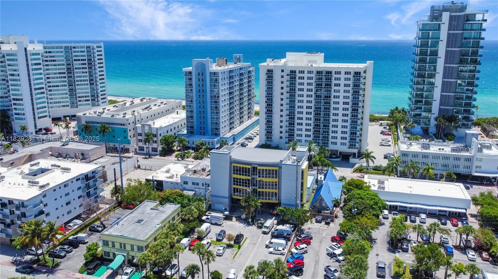 Preview of the West-side of 3936 Collins office and the adjacent and connect City Parking Lot at 3933 Harding Ave.  Park, pay and walk into the building lobby.