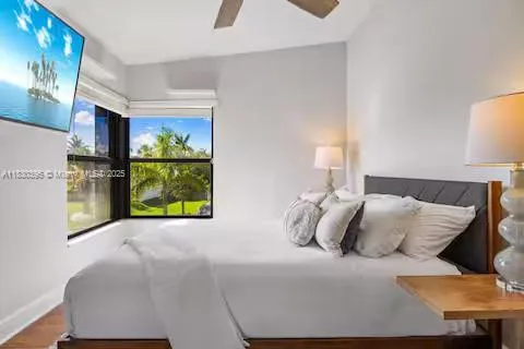 Bedroom with big screen TV and palm tree views!