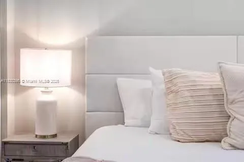 Tufted headboard luxury with soft neutral tones!