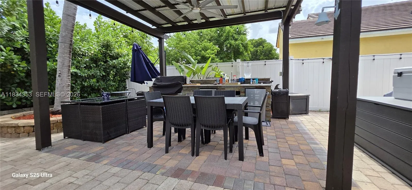 outdoor kitchen with Pergola with (BBQ grill and two mini fridge and sink)