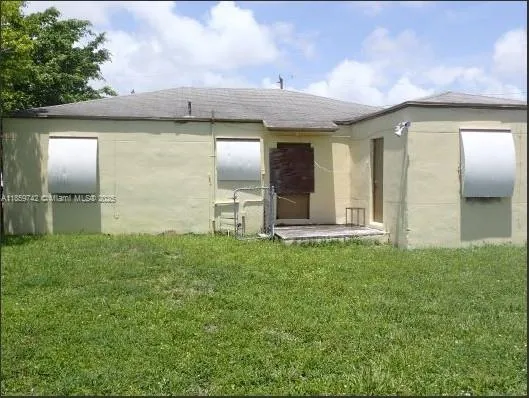 External view of corner house. Investor special