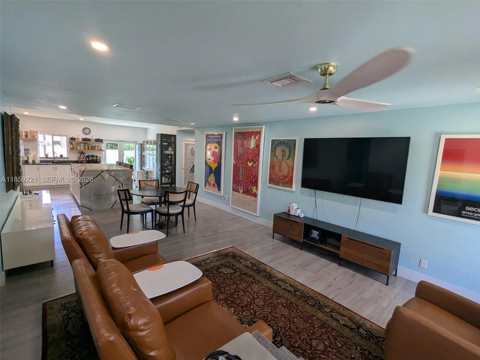 Spacious and modern open floor plan that brings together the kitchen, dining, and living spaces for effortless entertaining