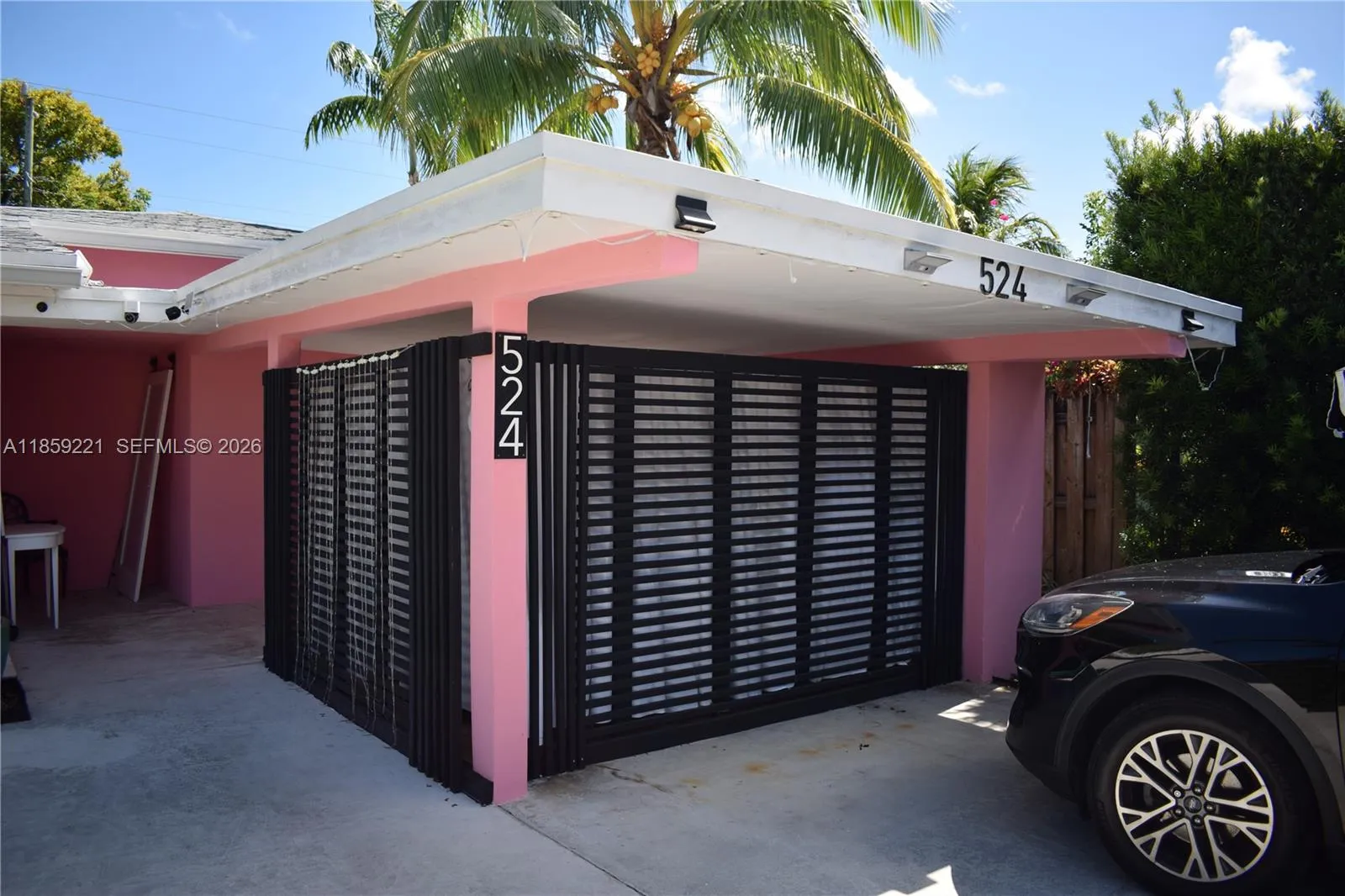 Adapted covered carport offers extra living space with endless possibilities—whether as a personal gym, art studio, or custom bar setup