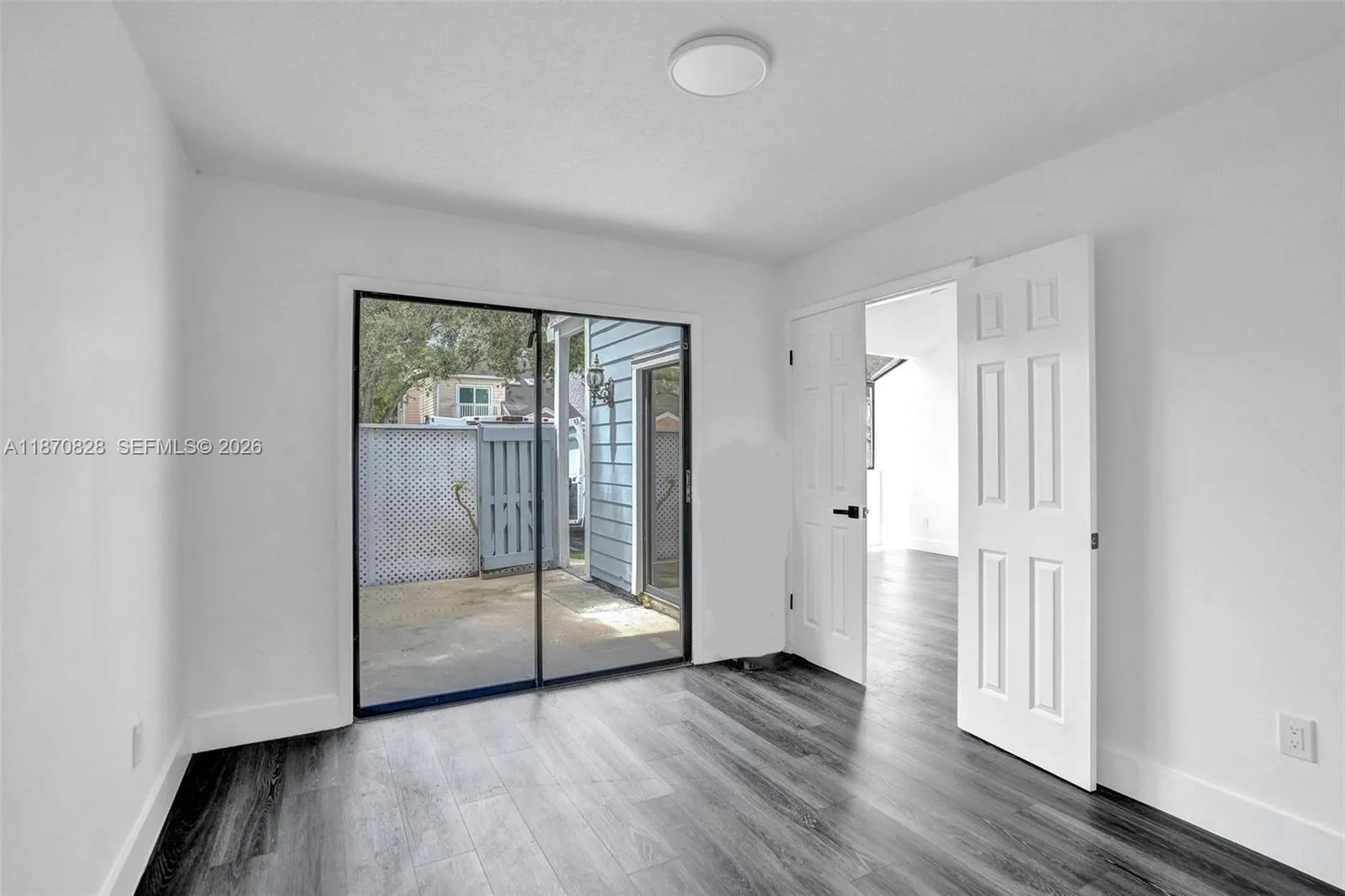 2nd bedroom downstairs with exit to front yard