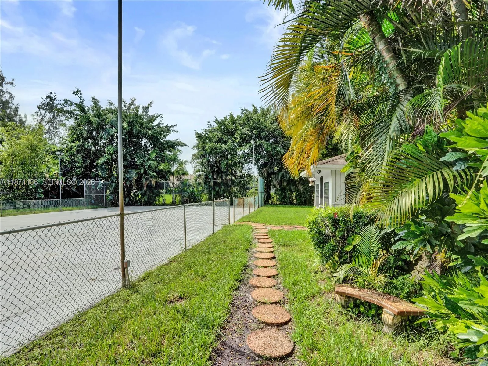 Walkway from pool deck to hardcourt and shed\n