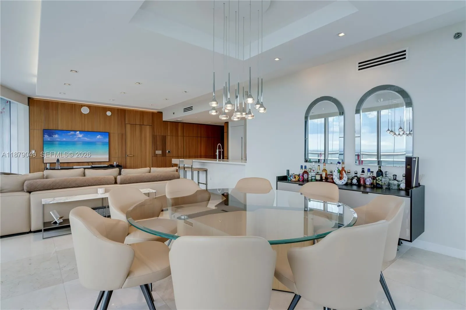 Open layout with lots of natural light, light fixtures and motorized  blackout Roller Shades on all glass windows and doors.