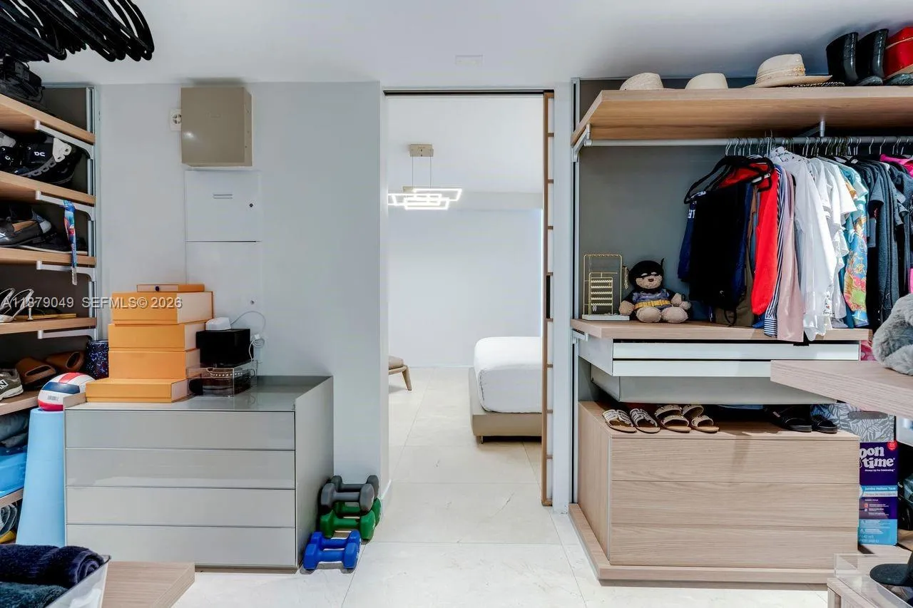 Primary Closet with leather panels and inside drawers.