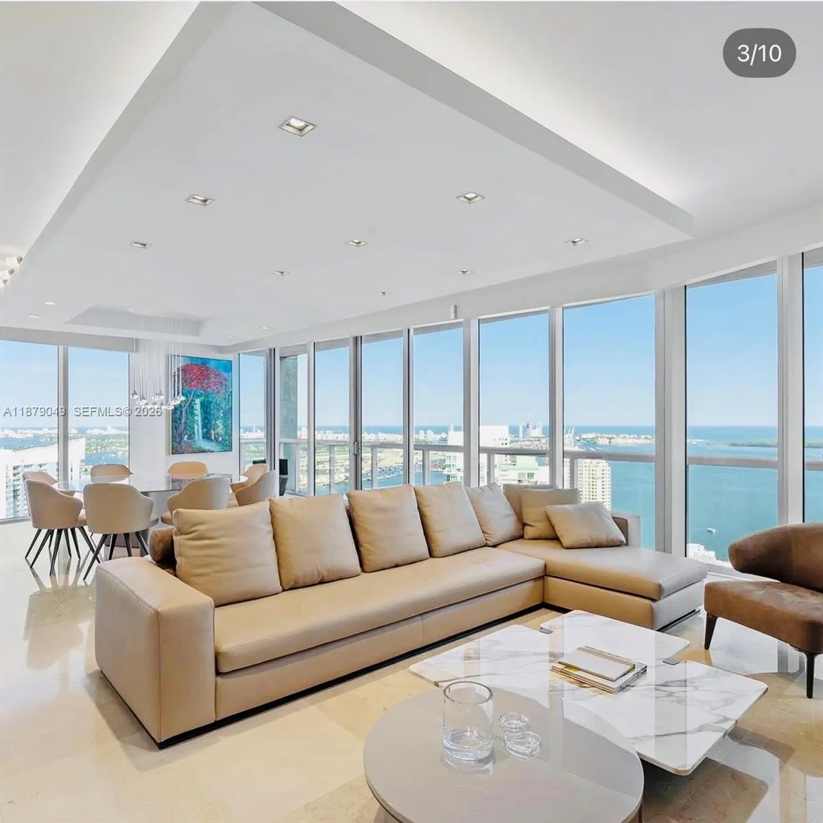 Open layout with lots of natural light, light fixtures and motorized  blackout Roller Shades on all glass windows and doors.