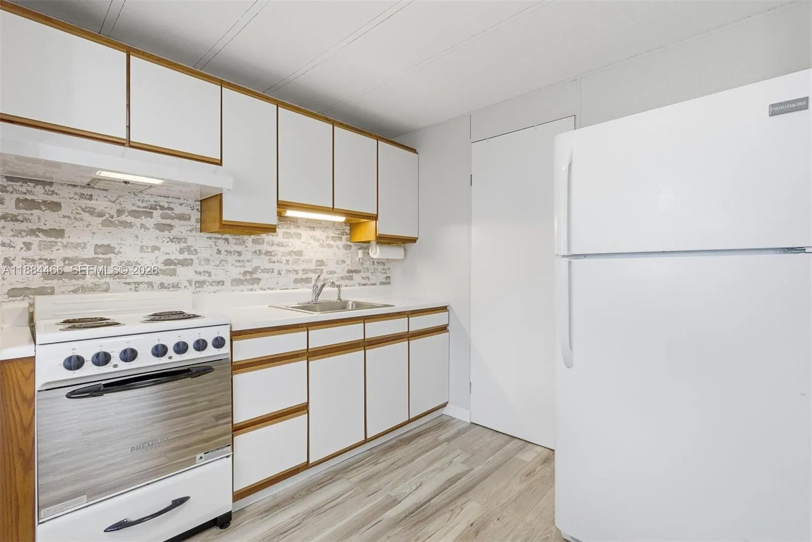 On side of kitchenette is second full bathroom
