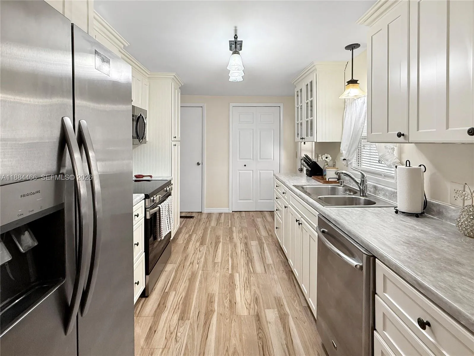 2 pantry closets with additional side pantry closet with pullouts.