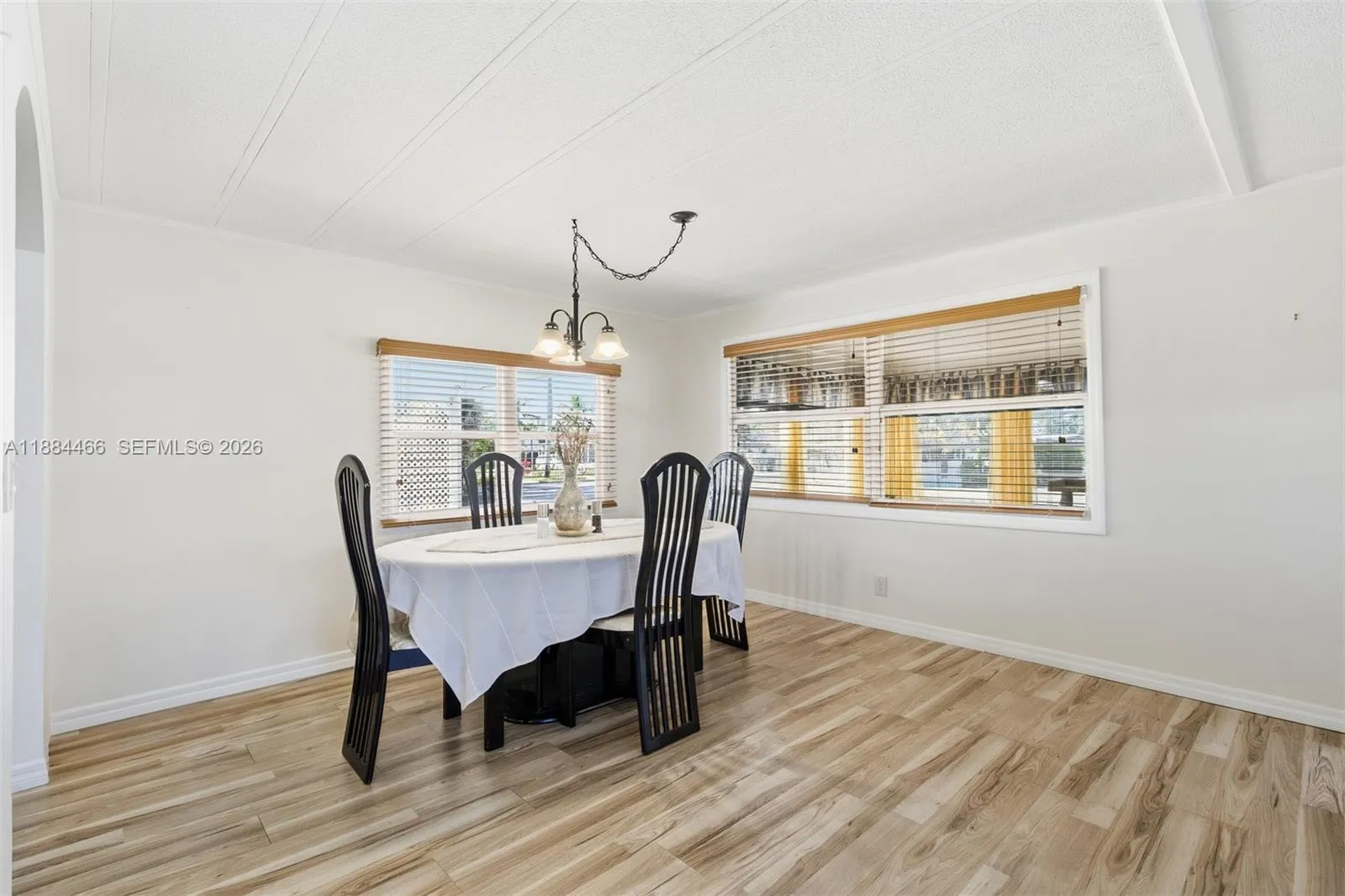 Brand New vinyl wood flooring installed throughout. Spacious dining room with new light fixture