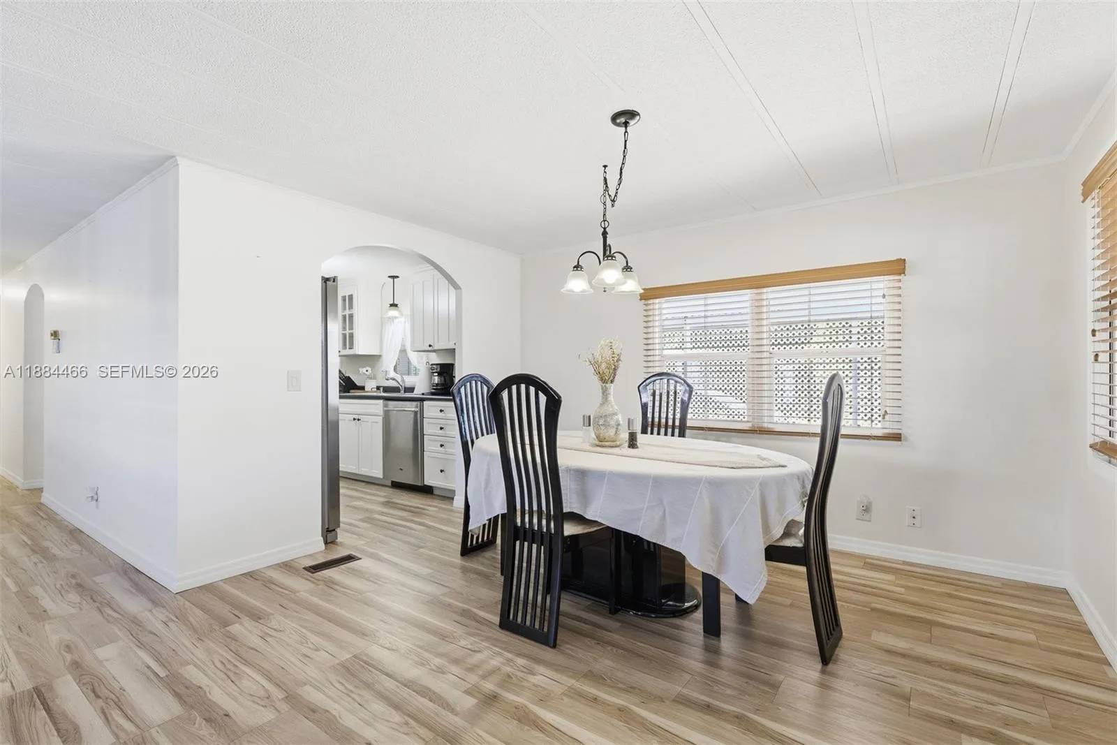 Spacious dining room with new light fixture