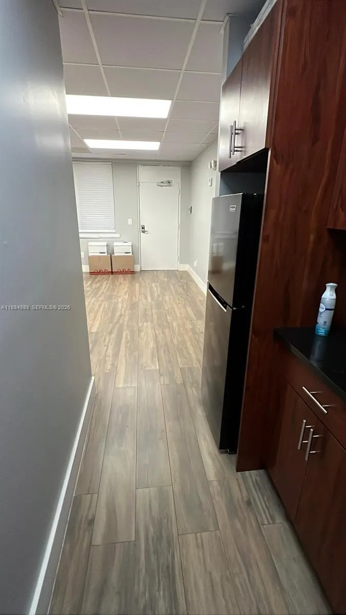 View from kitchen to main area and entrance