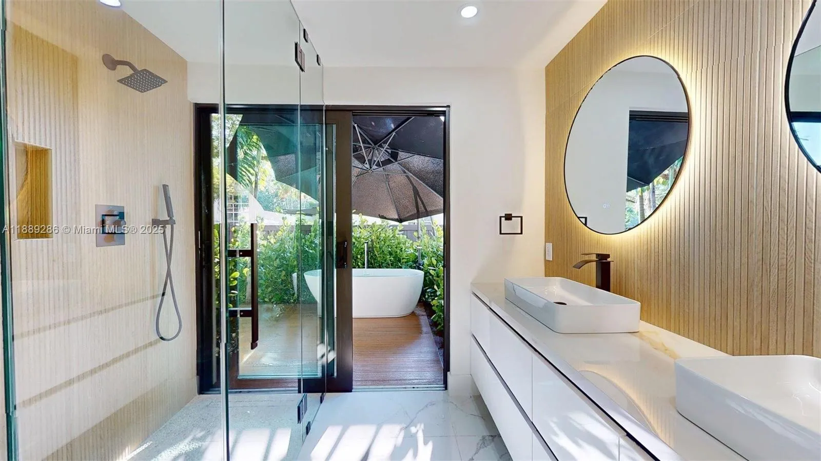 The primary bathroom feels right out of a tropical paradise resort!!