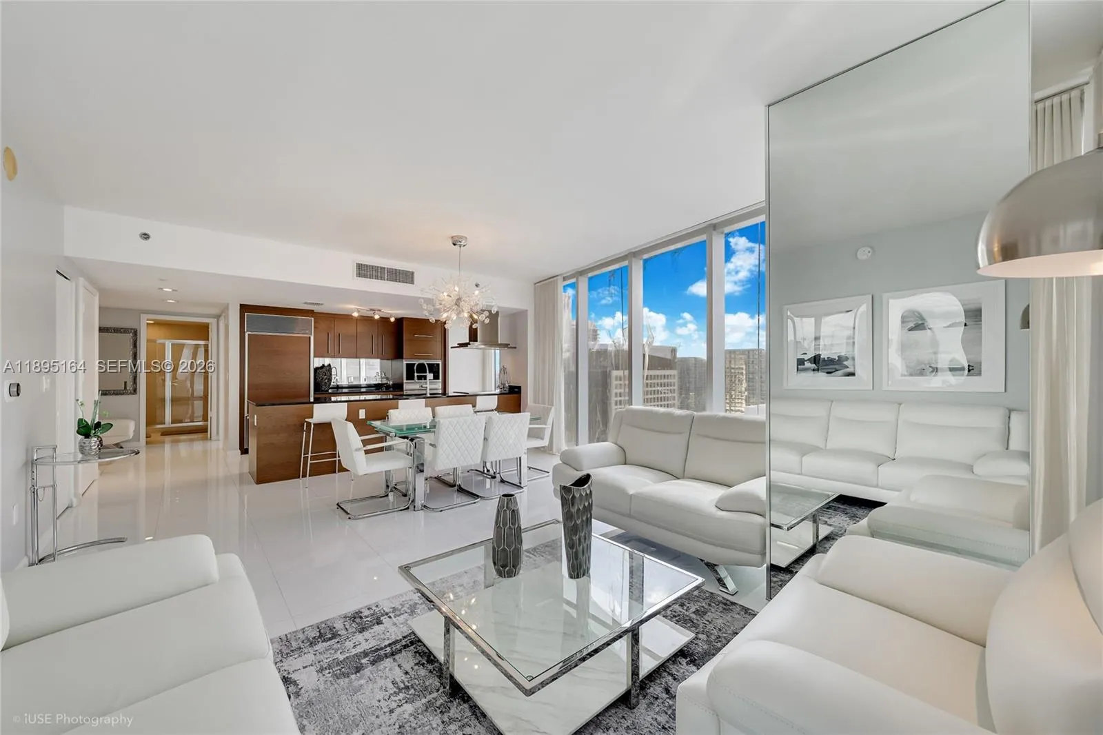 View of the living room and kitchen from the balcony door
