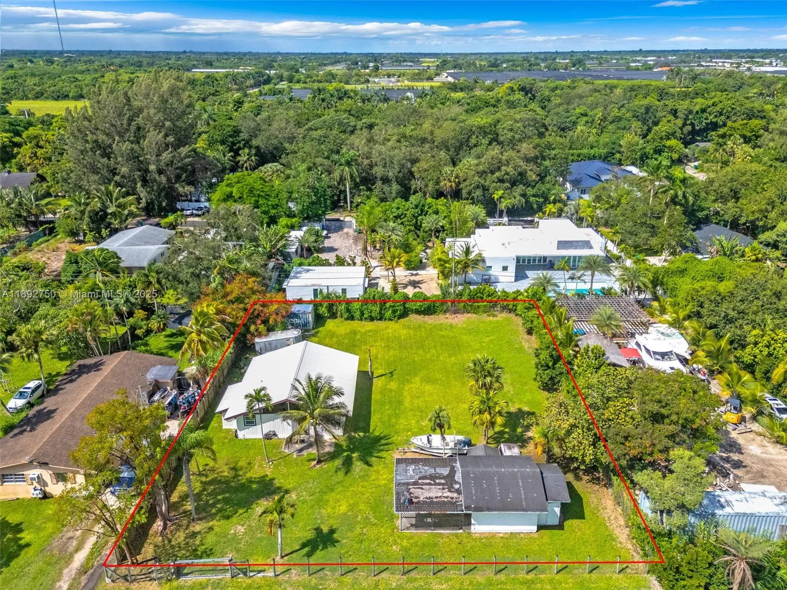 1/4 ACRE AERIAL VIEW W/ DETACHED GARAGE/WORKSHOP.