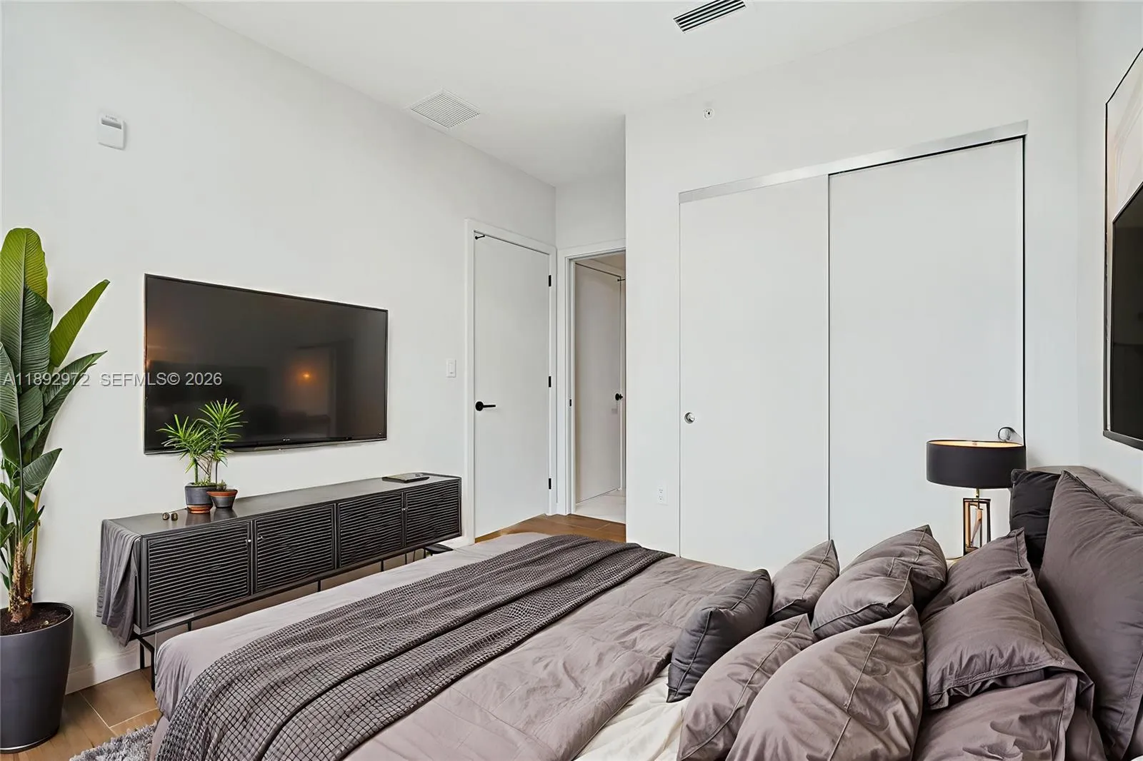 PRIMARY WITH PICTURESQUE CUT-OUT WINDOWS, DOUDLE SINKS, WALK IN CLOSETS.