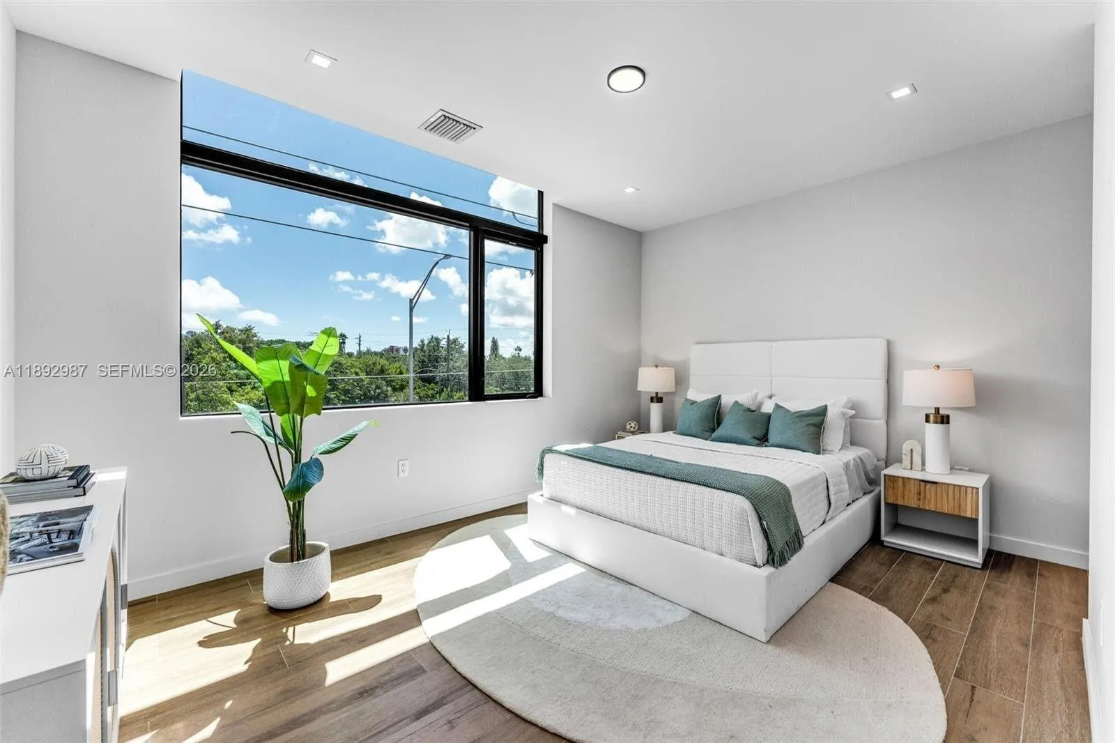 PRIMARY WITH PICTURESQUE CUT-OUT WINDOWS, DOUDLE SINKS, WALK IN CLOSETS.