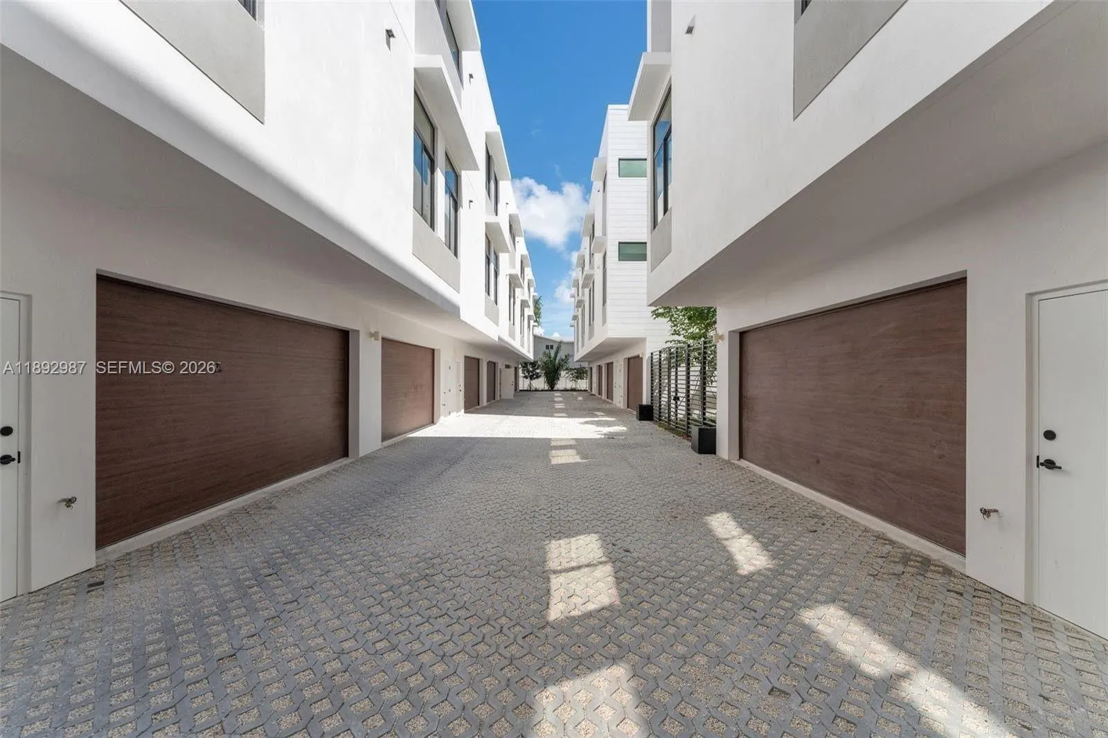 MASSIVE 2 CAR GARAGE WITH TANKLESS HWH & STORAGE AND ROOM FOR WALL OF BUIULT-IN CABINETS.