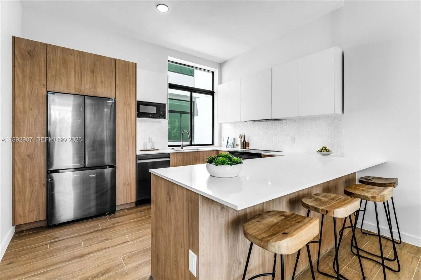 OPEN FLOOR PLAN CAN BE SET UP IN MULTIPLE WAYS. BREAKFAST BAR KITCHEN.